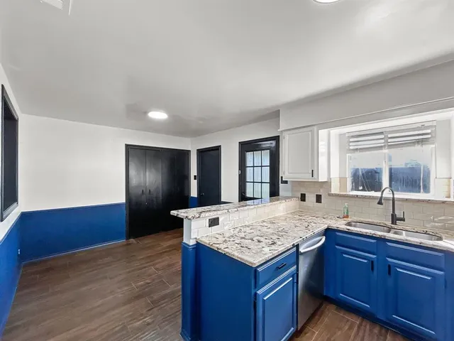 a close view of a utility room with dryer and washer