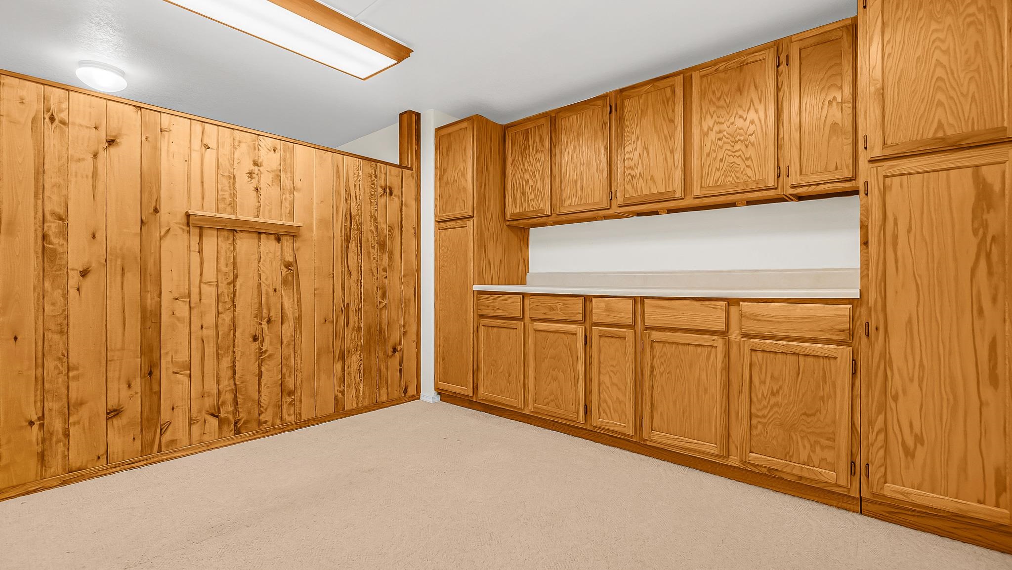 12 West Ridge Court Parachute, CO 81635 - Photo 19 of 37 a view of a refrigerator with wooden cabinets