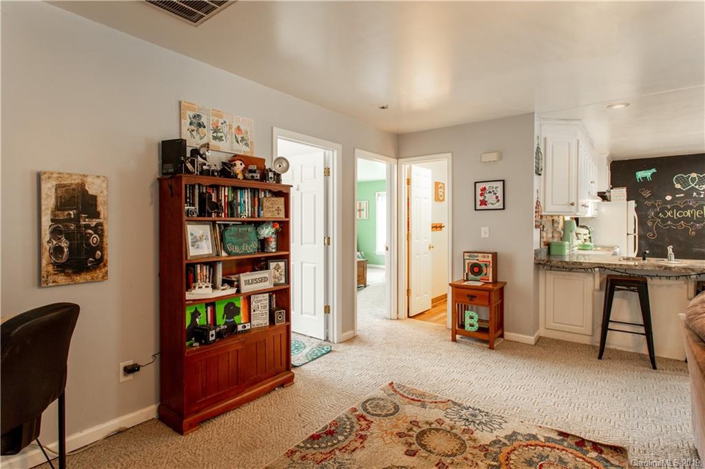 5520 Barrier Road Concord, NC 28025 - Photo 12 of 35 a bedroom with furniture and a book shelf