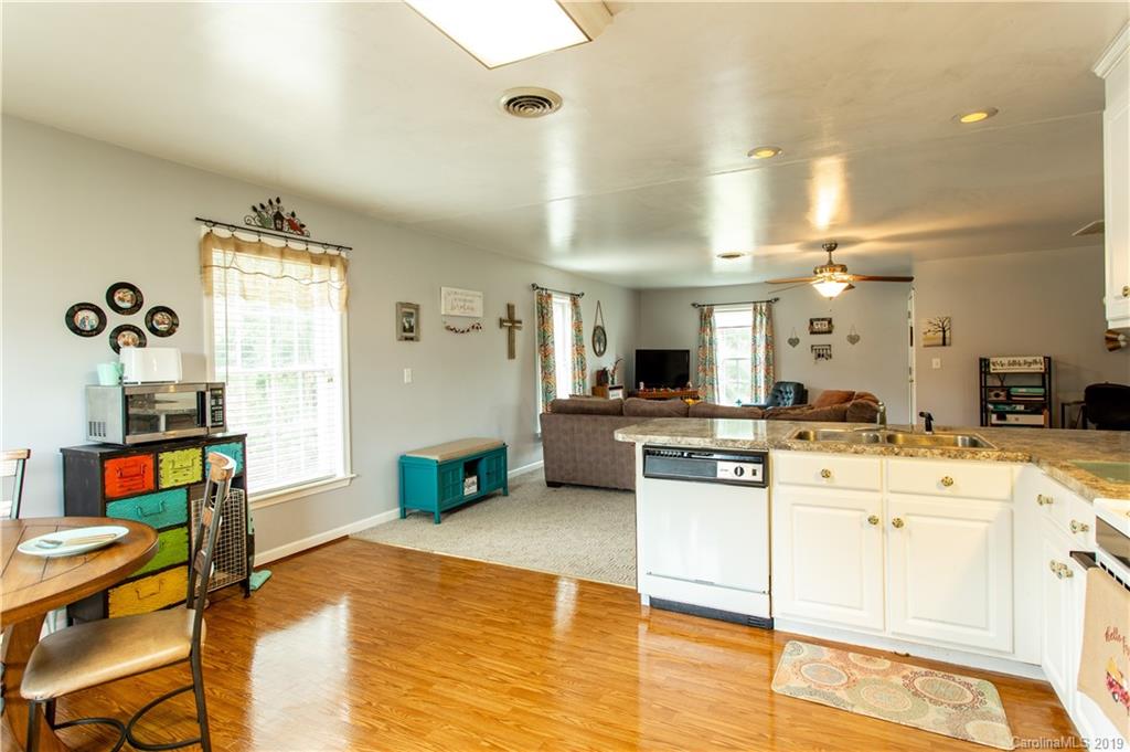 5520 Barrier Road Concord, NC 28025 - Photo 17 of 35 a large white kitchen with cabinets