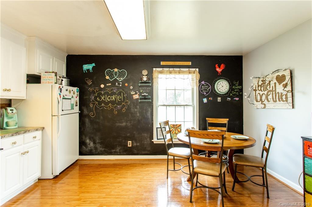 5520 Barrier Road Concord, NC 28025 - Photo 19 of 35 a view of a dining room with furniture and a window