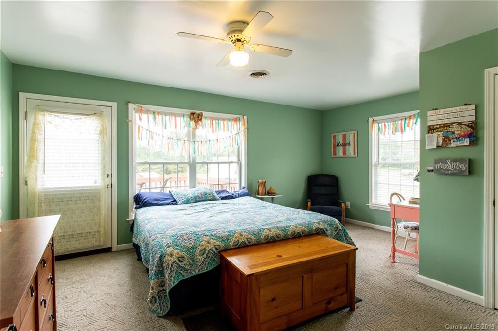 5520 Barrier Road Concord, NC 28025 - Photo 21 of 35 a bedroom with a bed dresser and a window