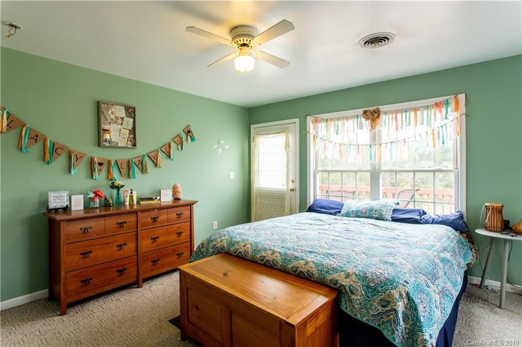 5520 Barrier Road Concord, NC 28025 - Photo 22 of 35 a bedroom with a bed and a dresser in it