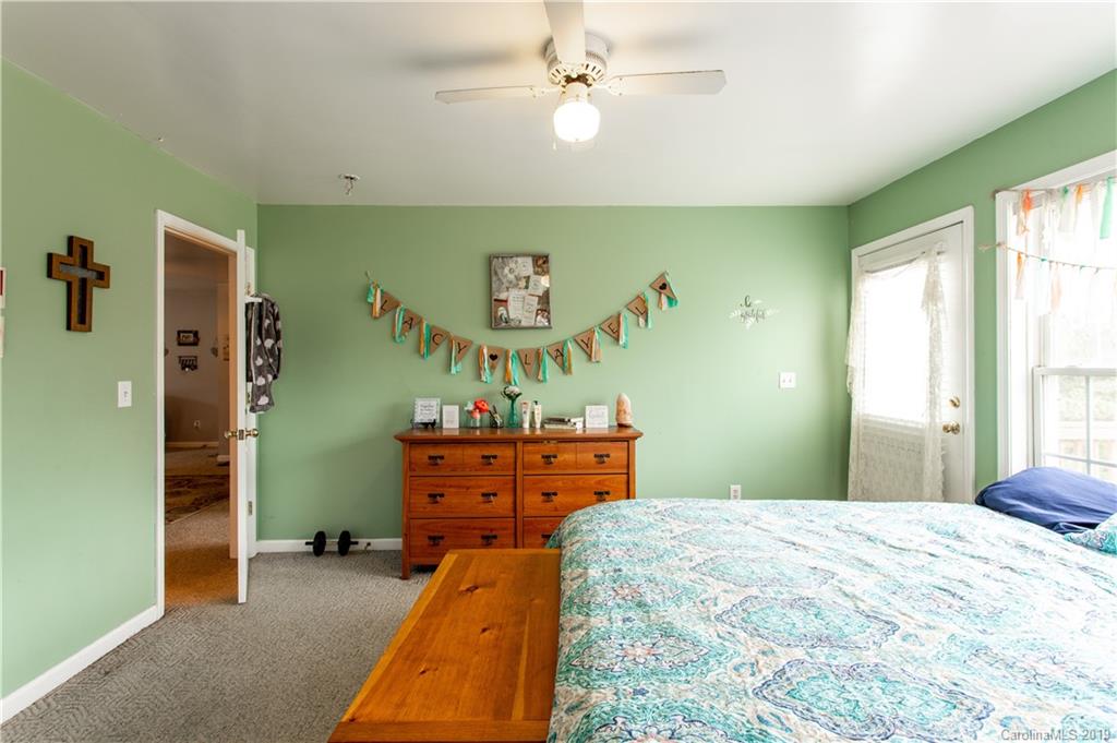 5520 Barrier Road Concord, NC 28025 - Photo 24 of 35 a bed room with a bed and a dresser