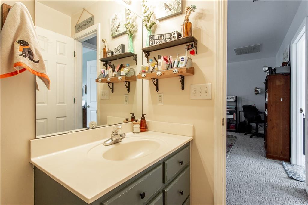 5520 Barrier Road Concord, NC 28025 - Photo 26 of 35 a bathroom with a sink and mirror