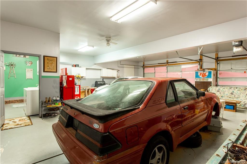 5520 Barrier Road Concord, NC 28025 - Photo 28 of 35 a car is parked in a garage