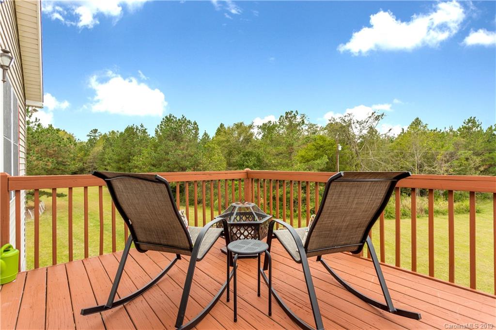 5520 Barrier Road Concord, NC 28025 - Photo 4 of 35 a view of a wooden chairs and table in the balcony