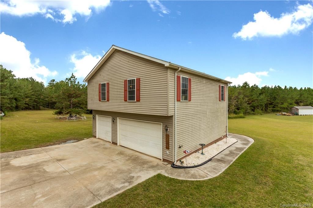 5520 Barrier Road Concord, NC 28025 - Photo 5 of 35 a view of a house with backyard and garden