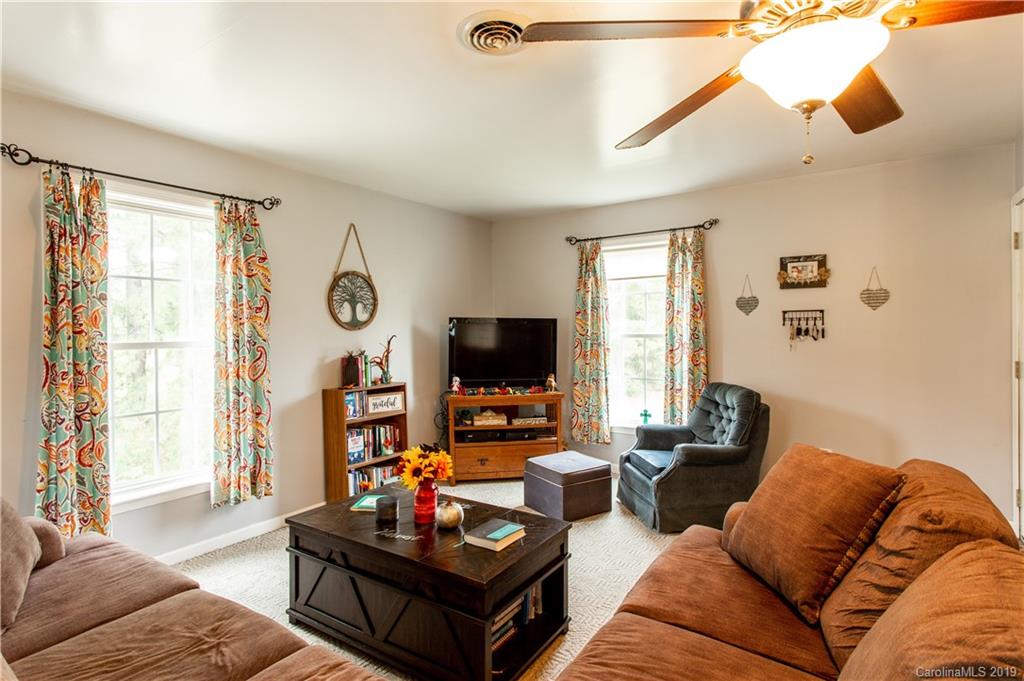 5520 Barrier Road Concord, NC 28025 - Photo 9 of 35 a living room with furniture and a flat screen tv