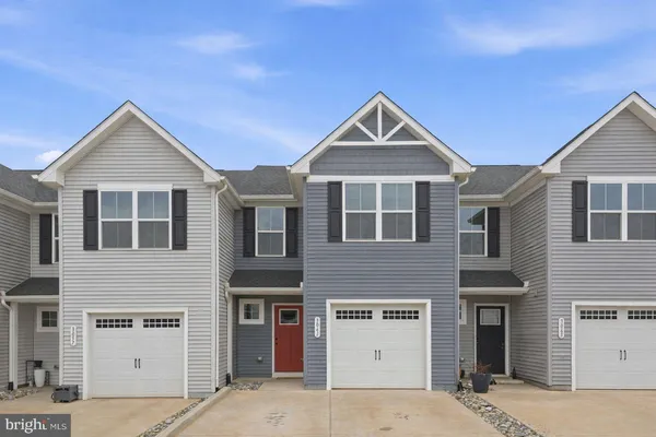 a front view of a house with a garage