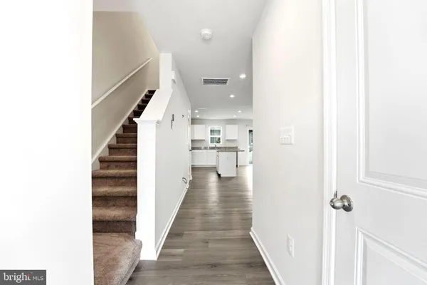 a view of a kitchen with a sink and a stove top oven
