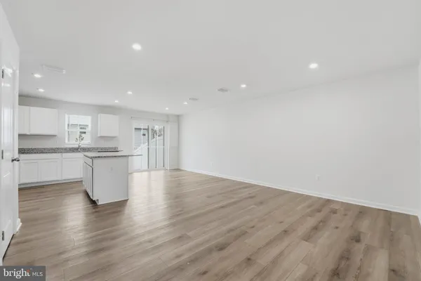a view of kitchen with wooden floor