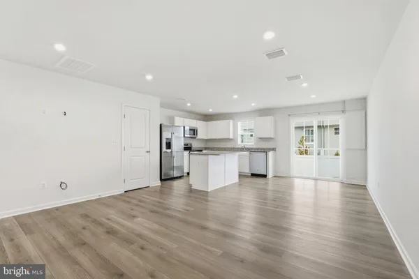 an empty room with wooden floor