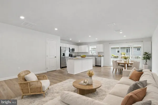 a living room with furniture kitchen and kitchen view
