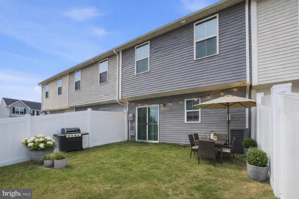 a front view of a house with yard