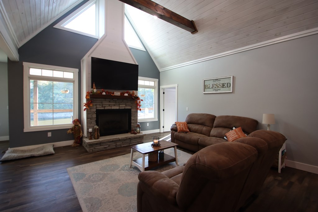 608 Lakeview Road Walling, TN 38587 - Photo 11 of 68 a living room with furniture a flat screen tv and a fireplace