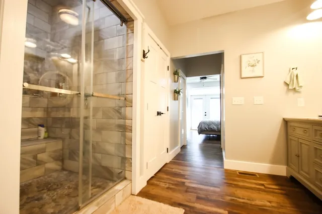 a bathroom with a toilet a sink and mirror