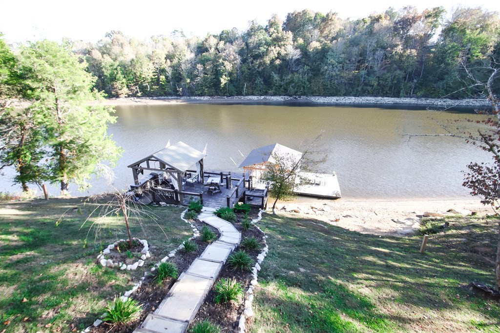 608 Lakeview Road Walling, TN 38587 - Photo 29 of 68 a view of a lake with a yard and a fountain