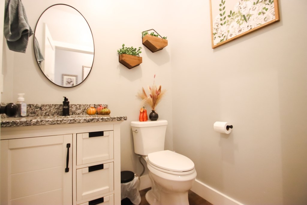 608 Lakeview Road Walling, TN 38587 - Photo 30 of 68 a bathroom with a toilet a sink and mirror