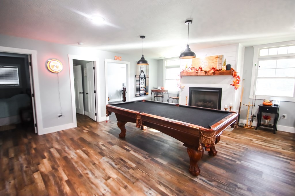 608 Lakeview Road Walling, TN 38587 - Photo 35 of 68 a living room with furniture a fireplace and a chandelier