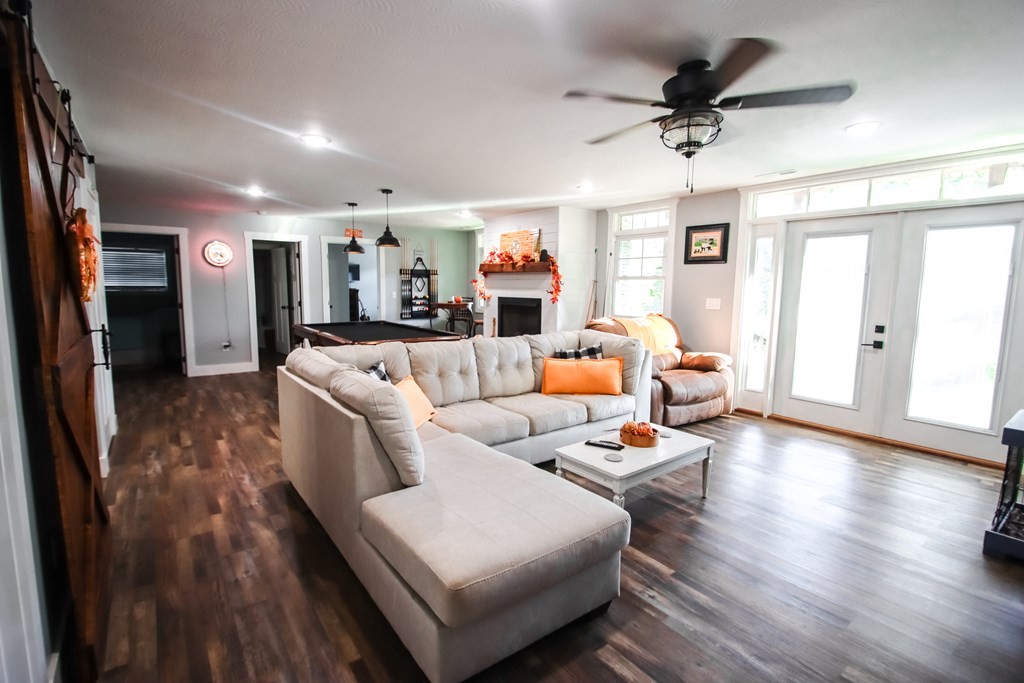 608 Lakeview Road Walling, TN 38587 - Photo 36 of 68 a living room with furniture and a wooden floor