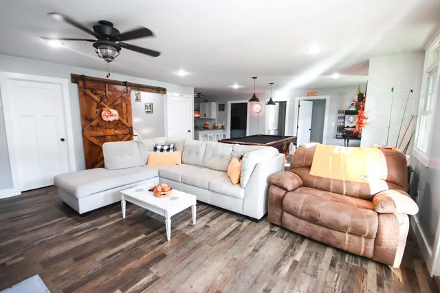 a view of deck with table and chairs