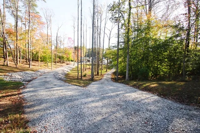 a view of a house with backyard