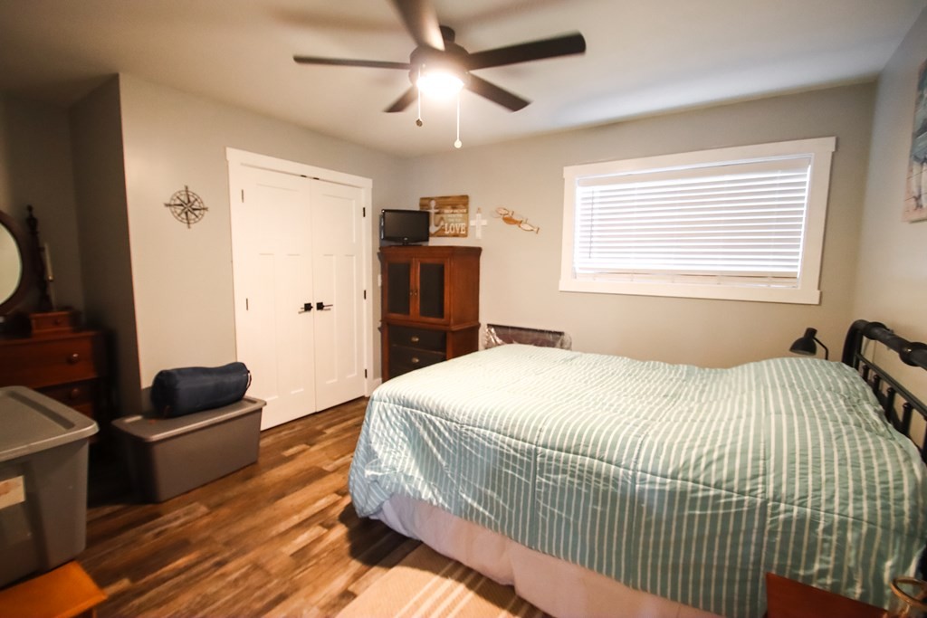 608 Lakeview Road Walling, TN 38587 - Photo 42 of 68 a bedroom with a bed and wooden floor