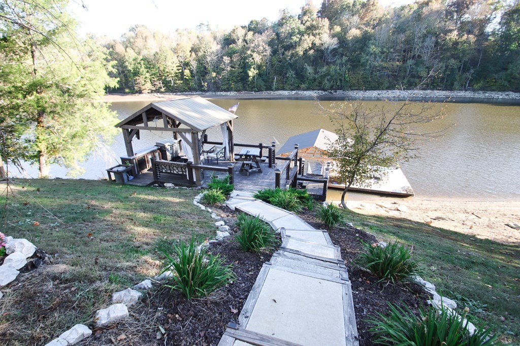 608 Lakeview Road Walling, TN 38587 - Photo 48 of 68 a view of a lake with a yard and a patio
