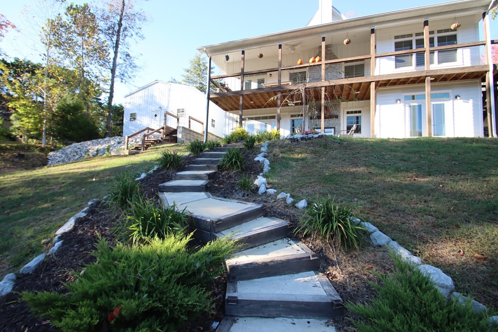 608 Lakeview Road Walling, TN 38587 - Photo 64 of 68 a view of a yard with plants and large trees