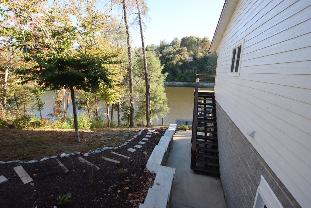 608 Lakeview Road Walling, TN 38587 - Photo 9 of 68 a view of a backyard with sitting area