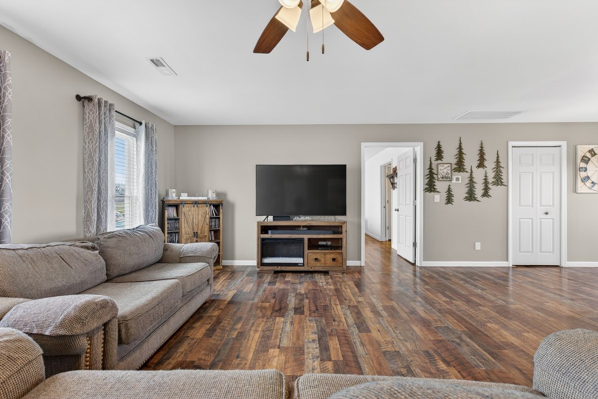 15419 Old Palestine Road Crofton, KY 42217 - Photo 13 of 53 a living room with furniture and a flat screen tv