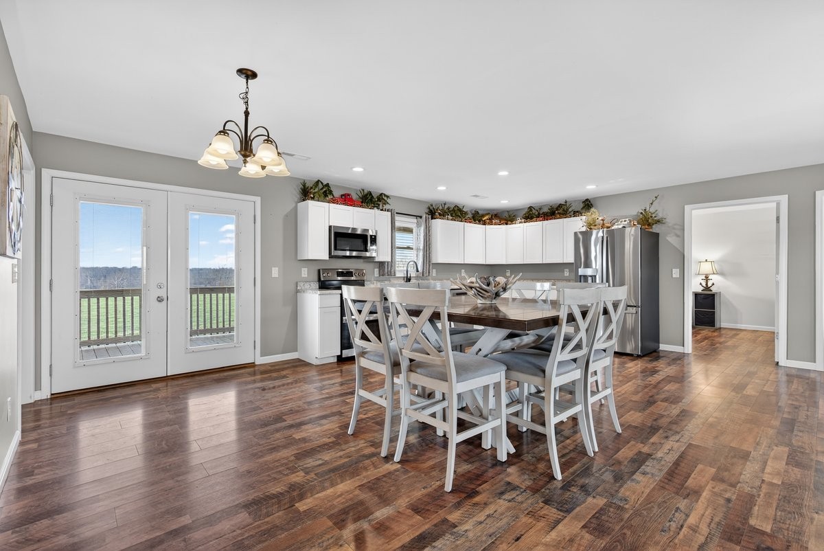 15419 Old Palestine Road Crofton, KY 42217 - Photo 21 of 53 a view of a dining room with furniture window and wooden floor