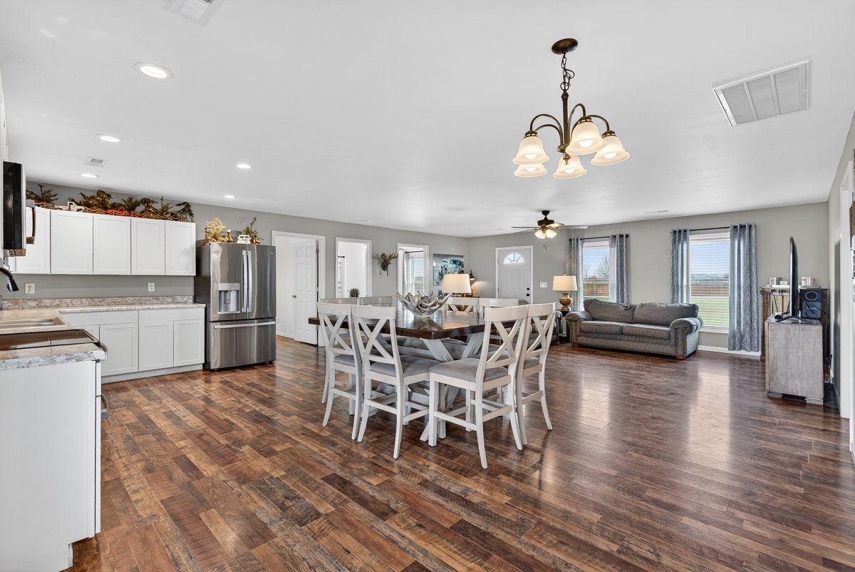 15419 Old Palestine Road Crofton, KY 42217 - Photo 23 of 53 a view of a dining room with furniture and wooden floor