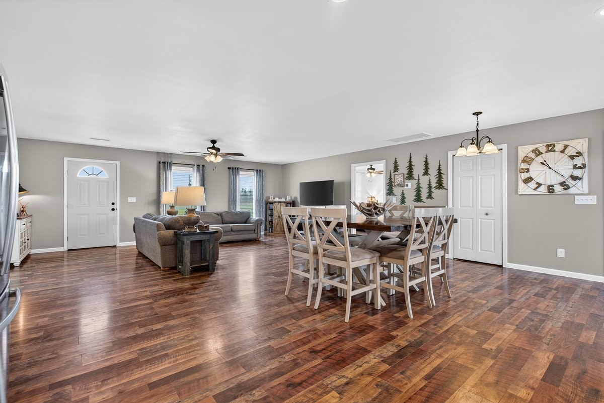 15419 Old Palestine Road Crofton, KY 42217 - Photo 24 of 53 a dining room with furniture a chandelier and wooden floor