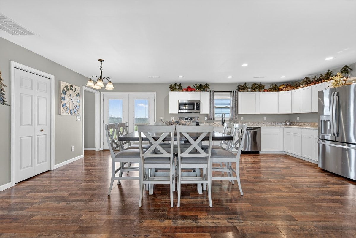 15419 Old Palestine Road Crofton, KY 42217 - Photo 25 of 53 a view of a dining room with furniture and wooden floor