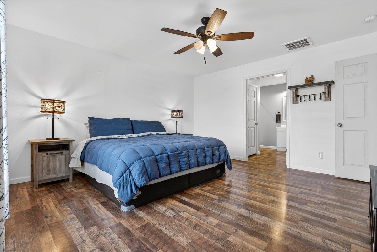 15419 Old Palestine Road Crofton, KY 42217 - Photo 27 of 53 a bedroom with a large bed chandelier and a window