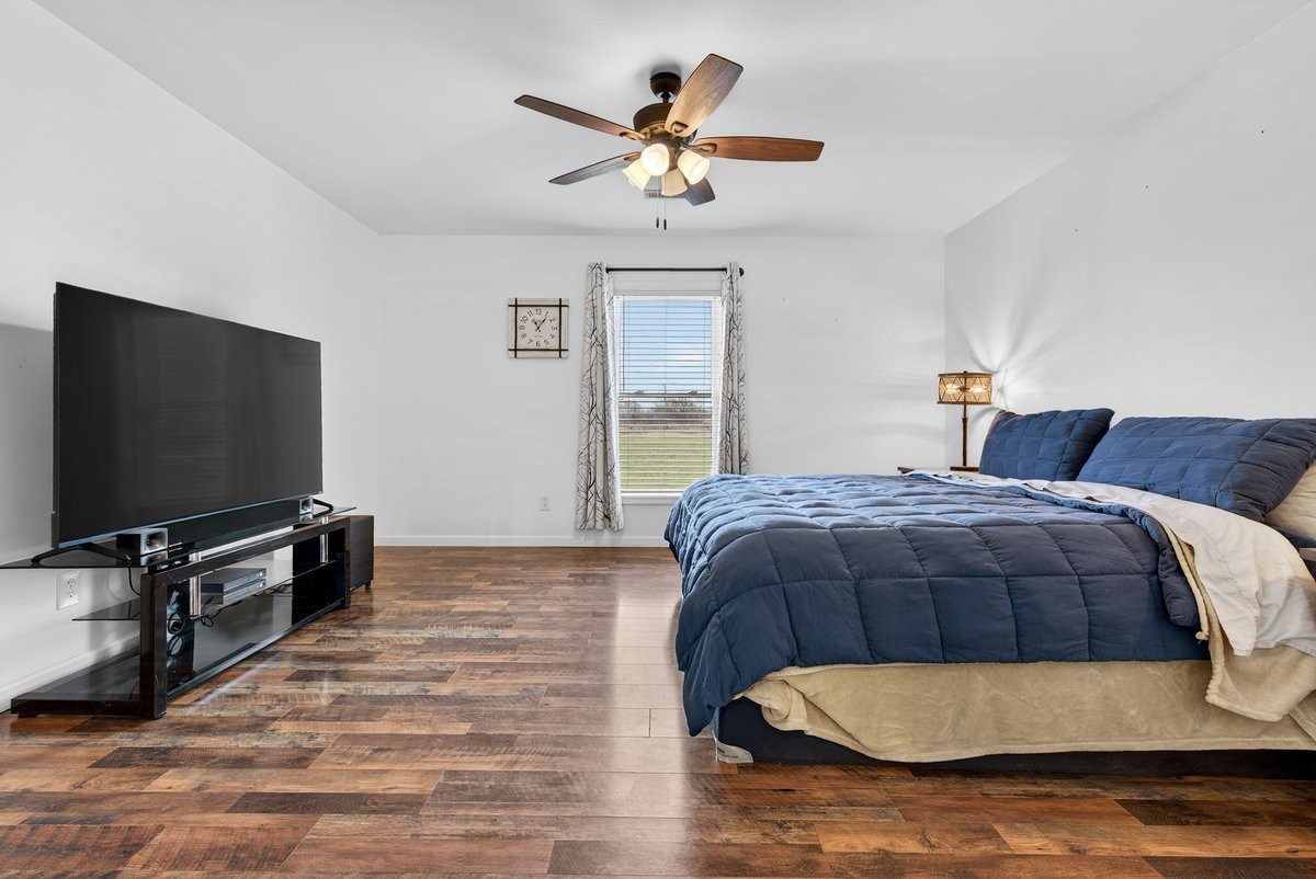 15419 Old Palestine Road Crofton, KY 42217 - Photo 28 of 53 a bedroom with a bed and a flat screen tv