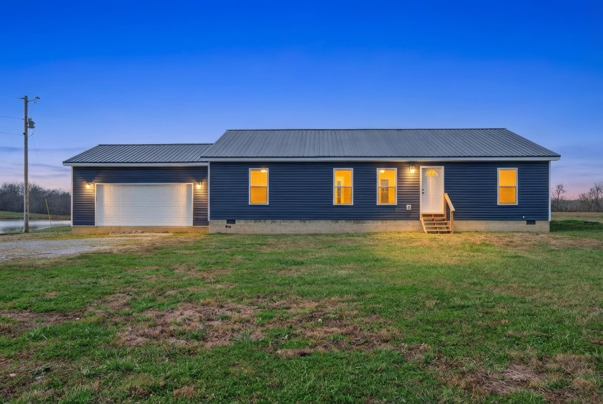 15419 Old Palestine Road Crofton, KY 42217 - Photo 3 of 53 a front view of a house with a yard