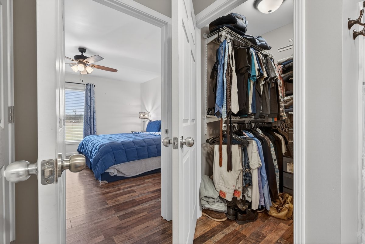 15419 Old Palestine Road Crofton, KY 42217 - Photo 33 of 53 a view of walk in closet with clothes and shoes