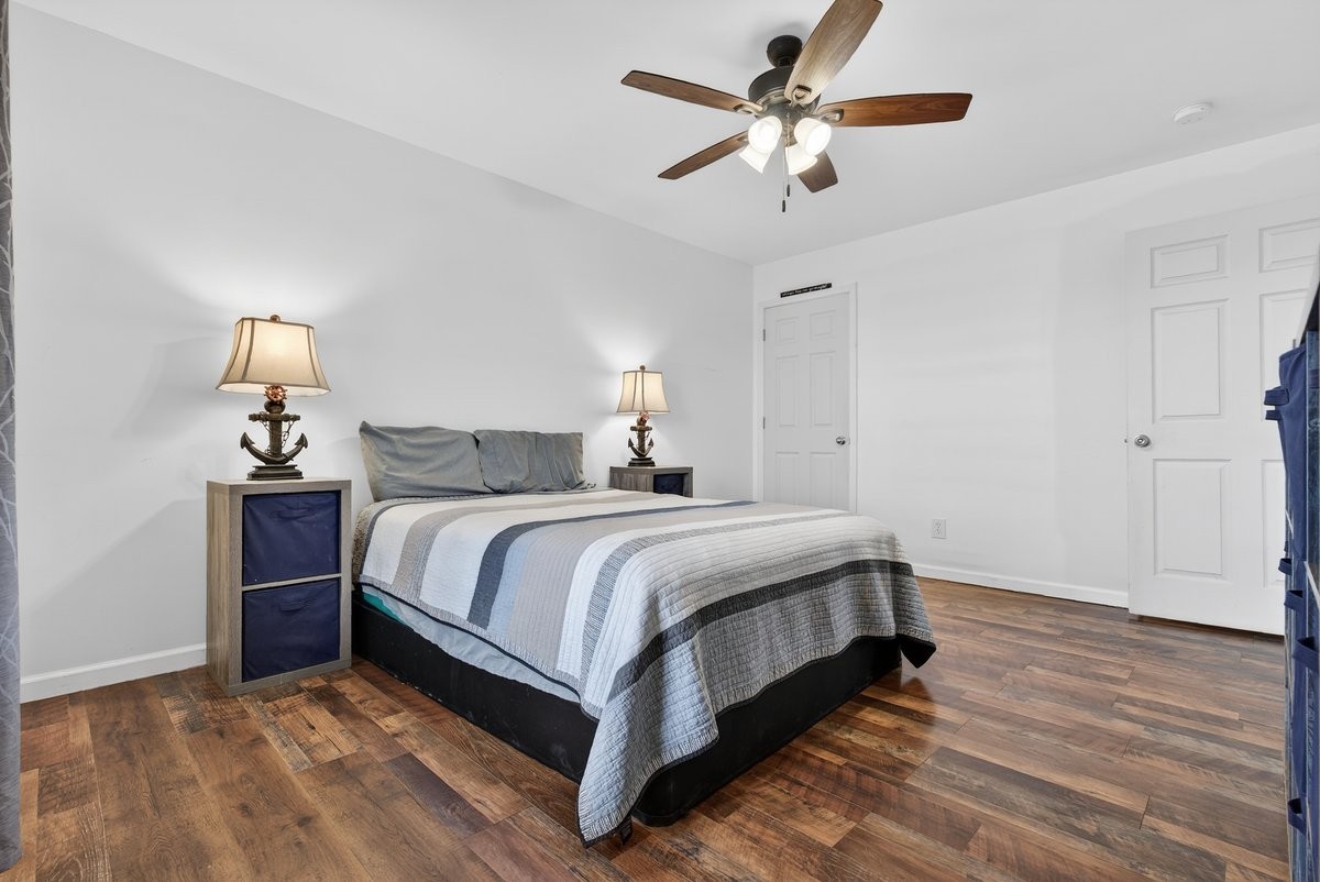 15419 Old Palestine Road Crofton, KY 42217 - Photo 34 of 53 a bedroom with a bed and a chandelier