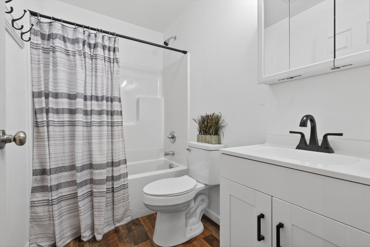 15419 Old Palestine Road Crofton, KY 42217 - Photo 37 of 53 a bathroom with a sink a toilet and shower