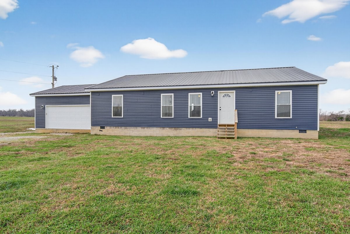15419 Old Palestine Road Crofton, KY 42217 - Photo 5 of 53 a view of a house with a backyard