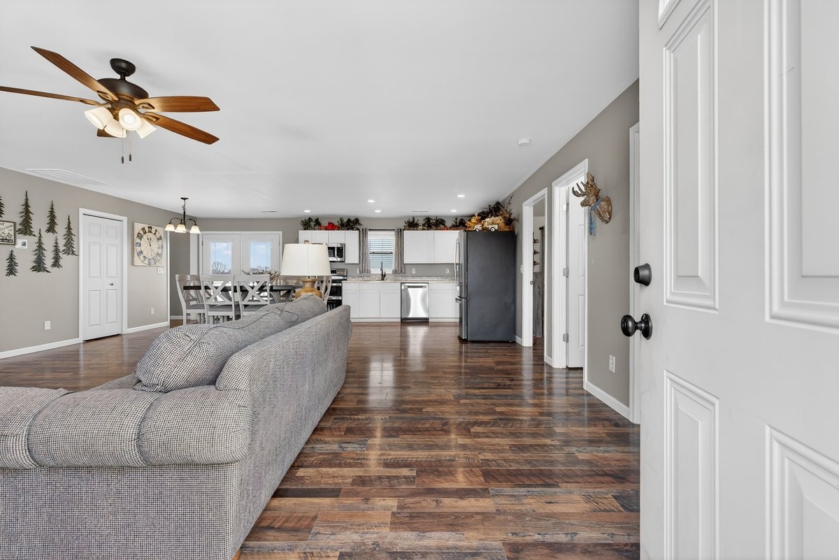 15419 Old Palestine Road Crofton, KY 42217 - Photo 9 of 53 a living room with furniture and a chandelier
