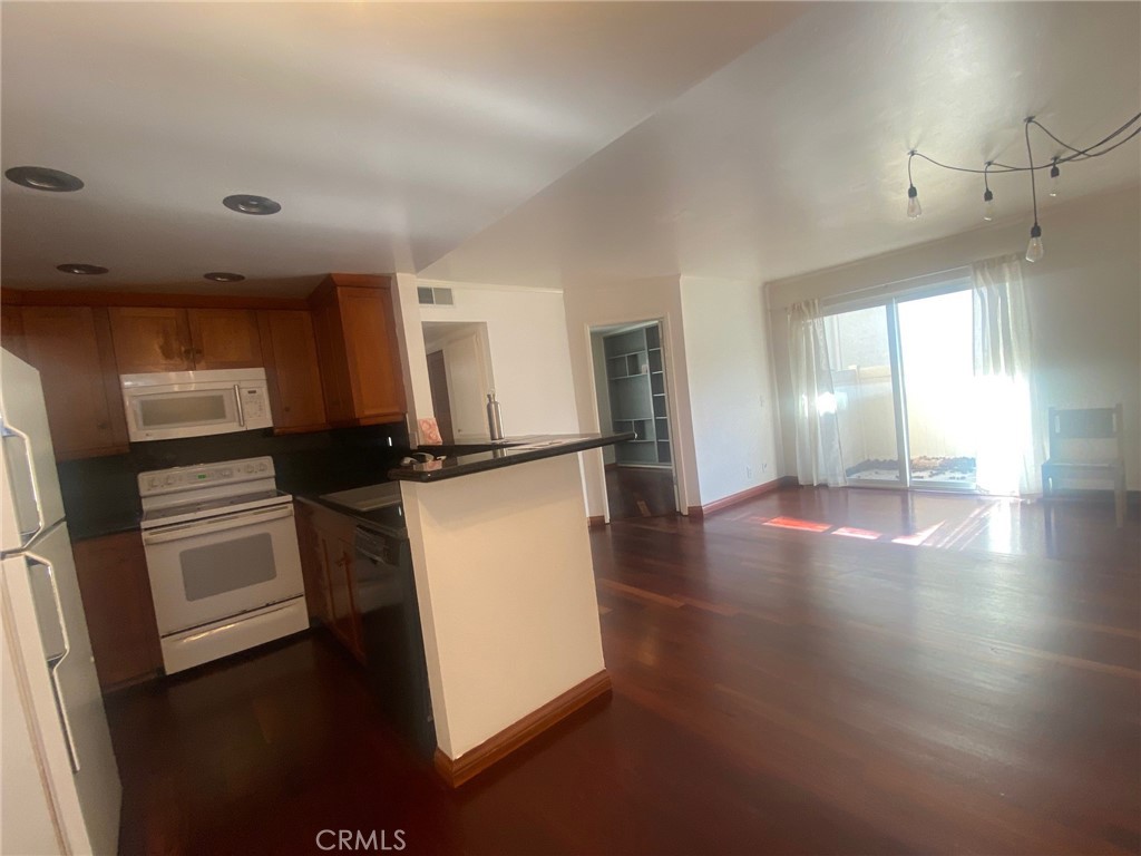 3103 Evening Way, Unit B La Jolla, CA 92037 - Photo 2 of 10 a view of a kitchen with a sink and a refrigerator