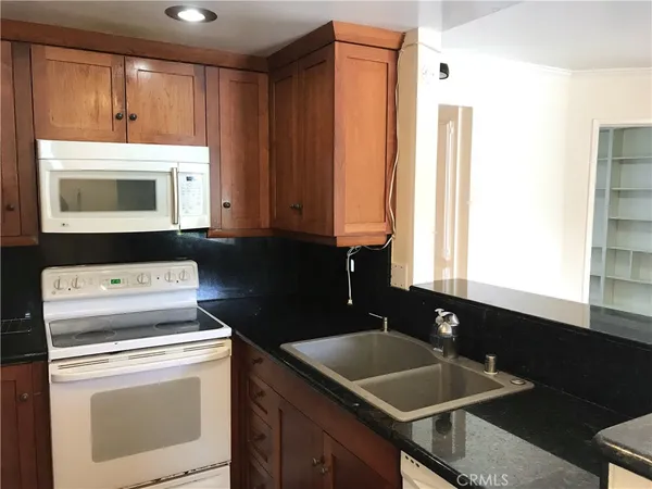 a view of kitchen and sink