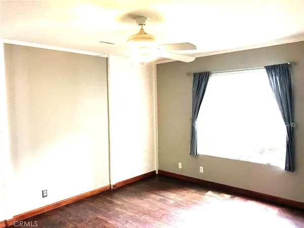 a view of front door with wooden floor