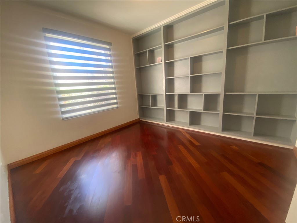 3103 Evening Way, Unit B La Jolla, CA 92037 - Photo 6 of 10 a view of a room with wooden floor and a window