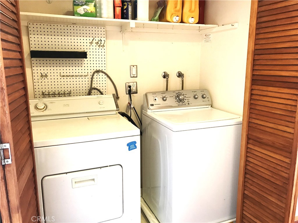 3103 Evening Way, Unit B La Jolla, CA 92037 - Photo 9 of 10 a utility room with dryer and washer