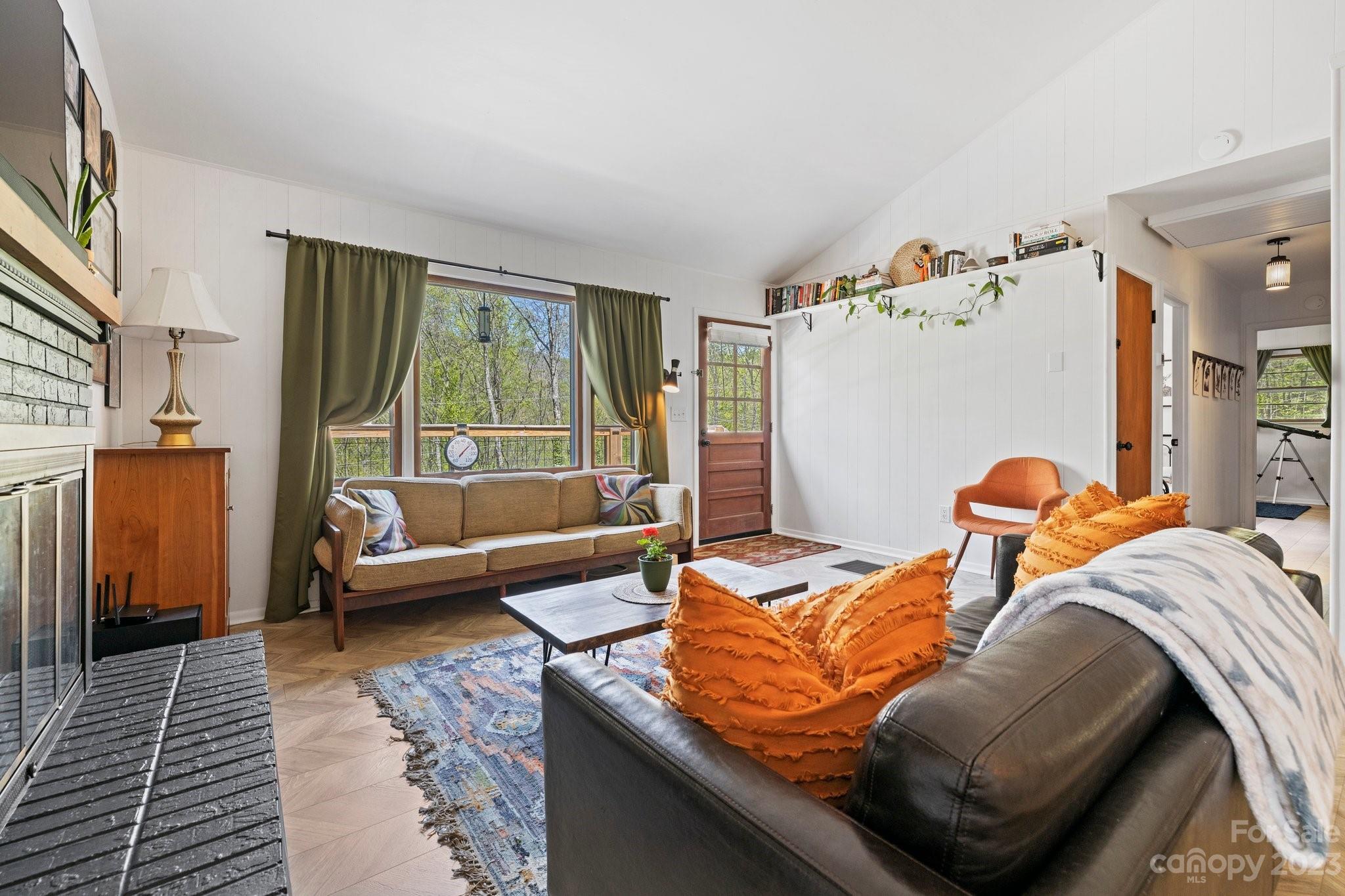 316 Rules Run Road Clyde, NC 28721 - Photo 11 of 47 a living room with furniture and a large window
